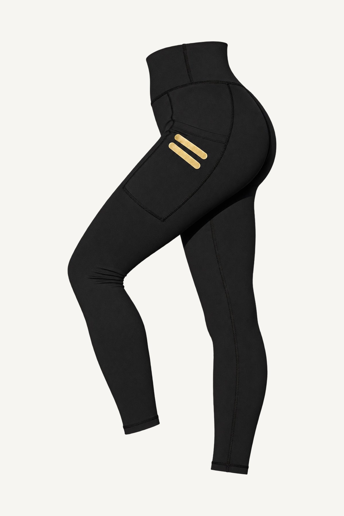 Iconic Stripe Tights Med Lommer frilagt, skrått forfra. Lommer på begge ben med to korte gullstreker.